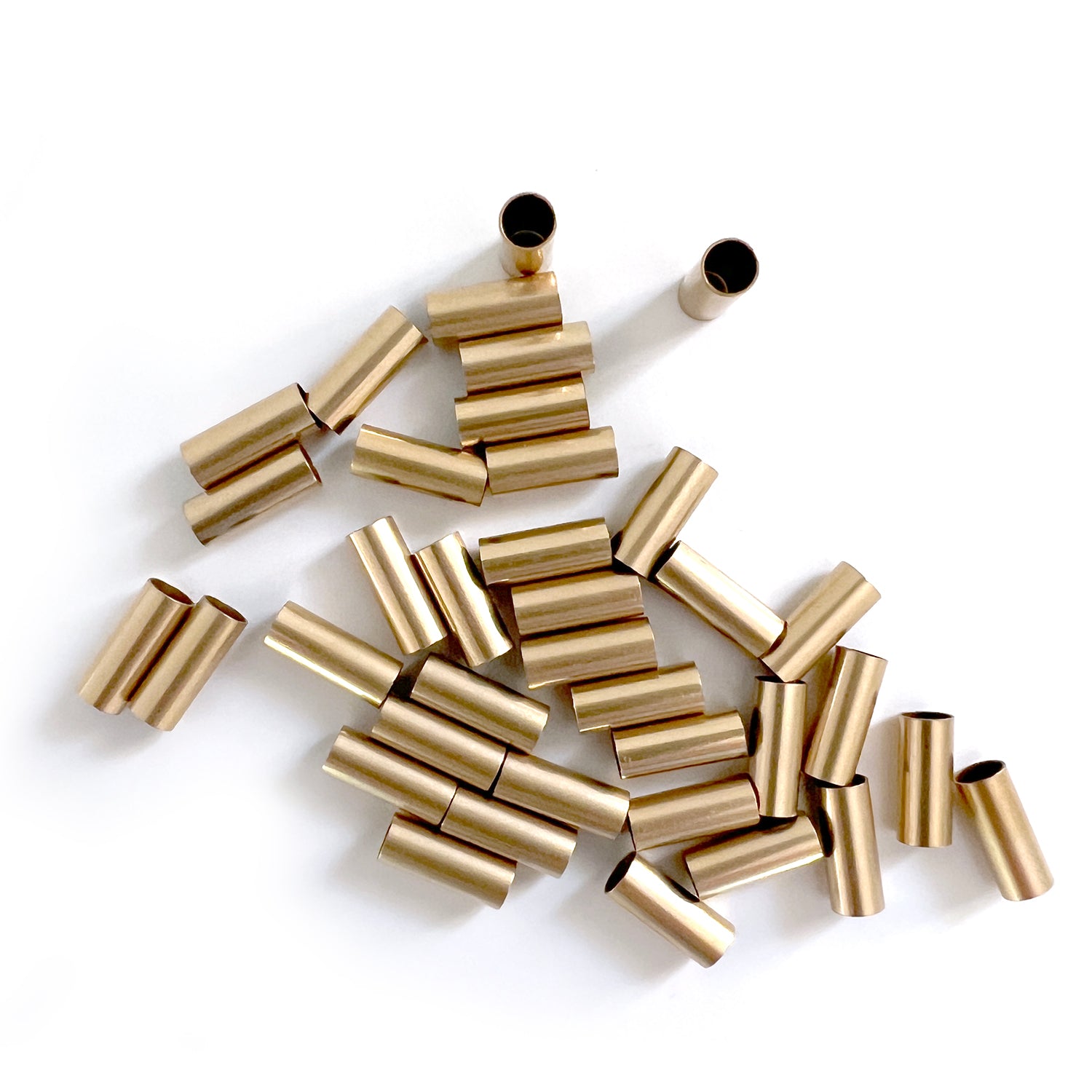 Perlina tubolare riempita d'oro