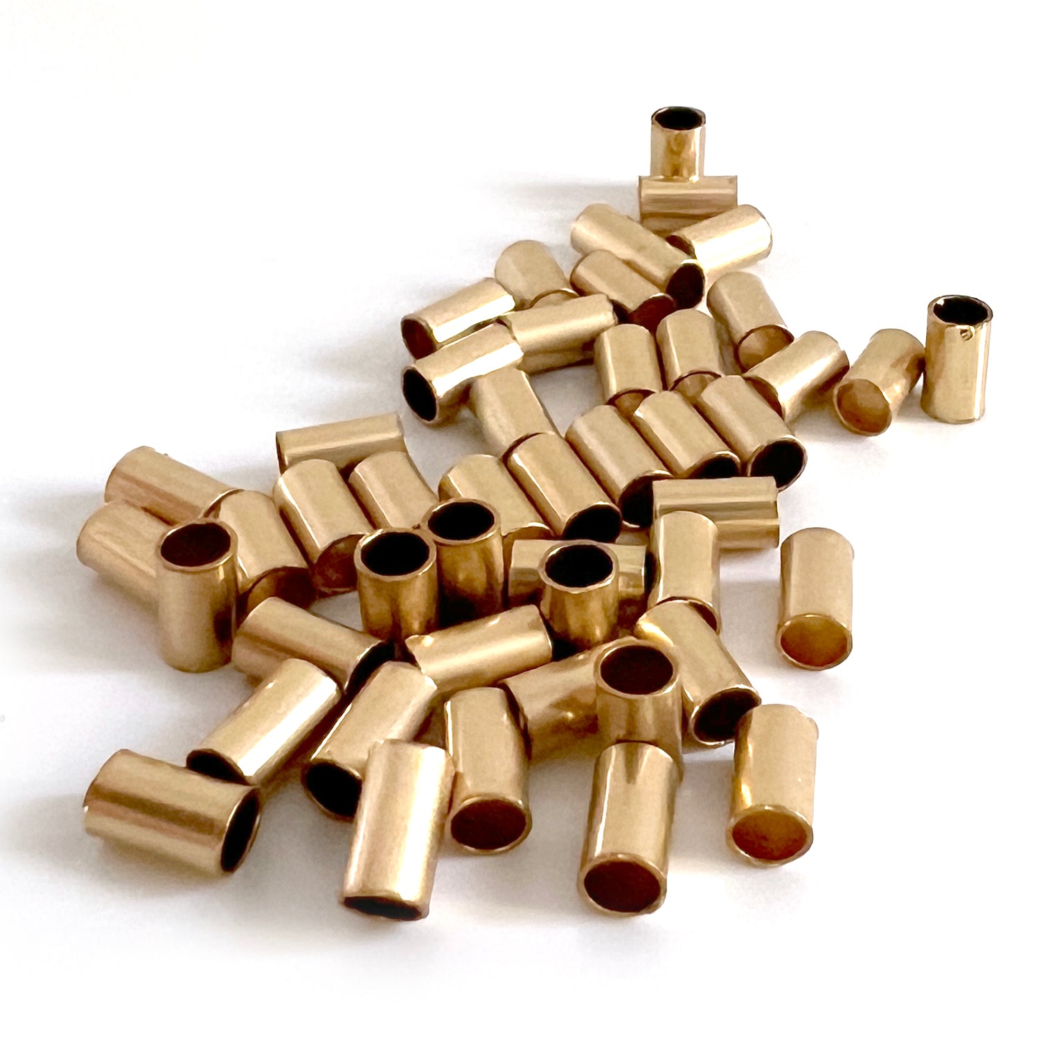 Perlina tubolare riempita d'oro