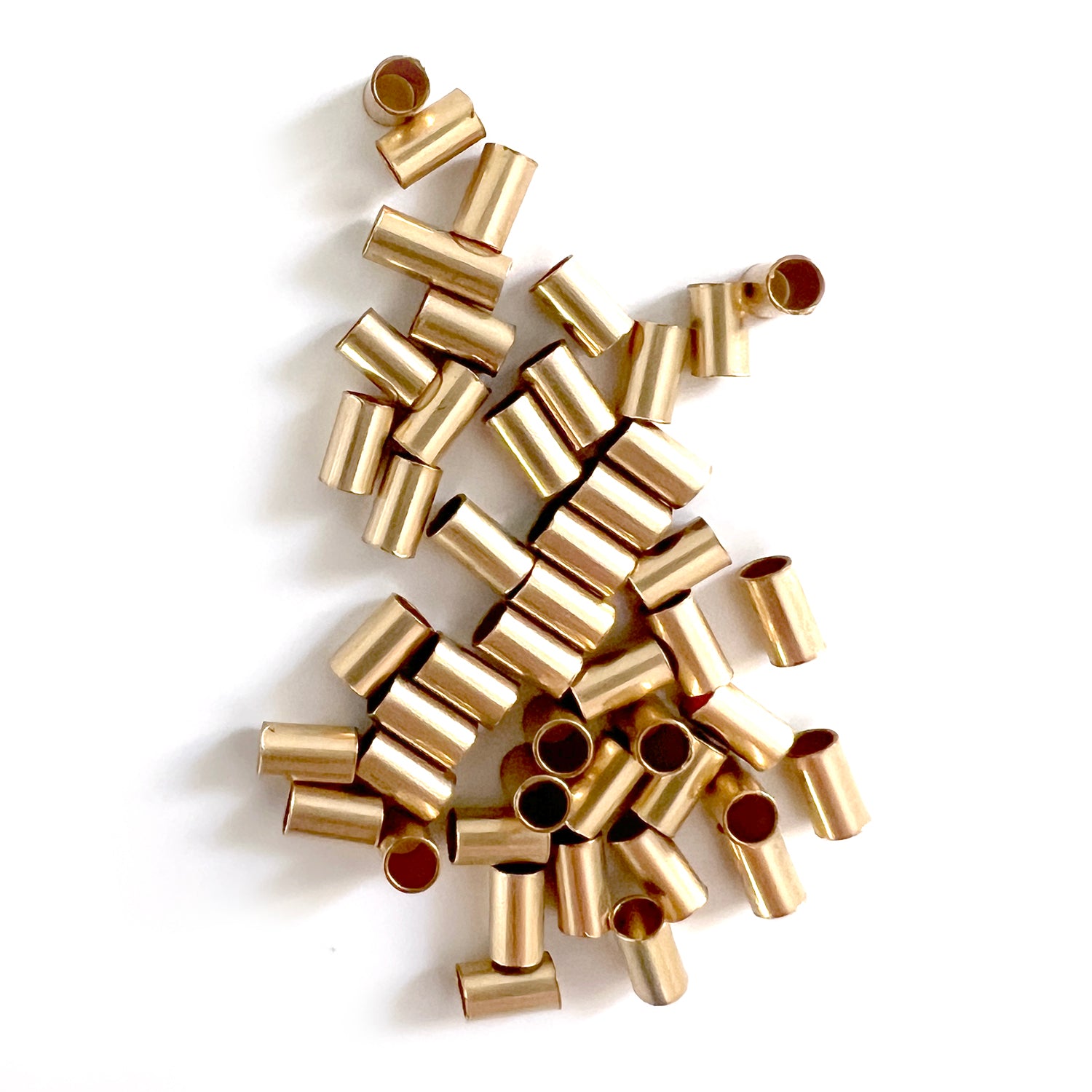 Perlina tubolare riempita d'oro