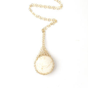 Round IVORY Howlite pendant necklace, nested in gold wire crochet - Yooladesign