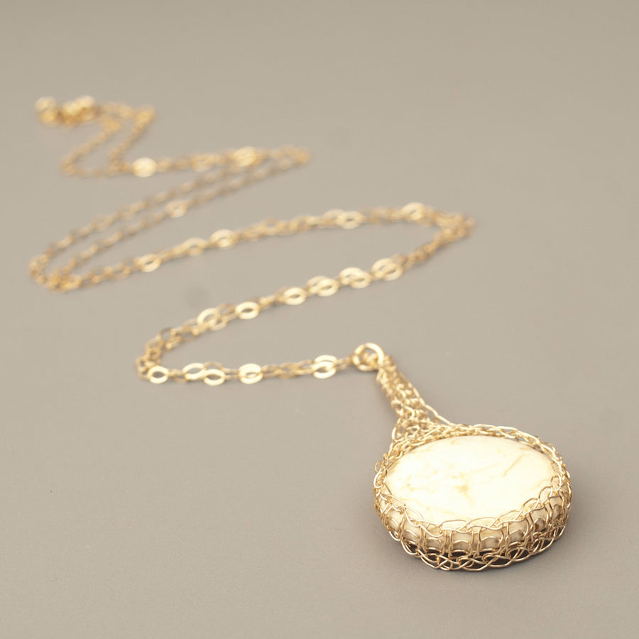 Round IVORY Howlite pendant necklace, nested in gold wire crochet - Yooladesign