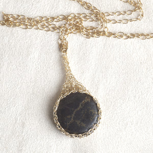 Large round Pyrite pendant necklace, nested in gold wire crochet - Yooladesign