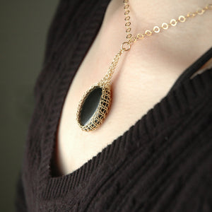 Black Onyx  pendant necklace, nested in gold wire crochet - Yooladesign